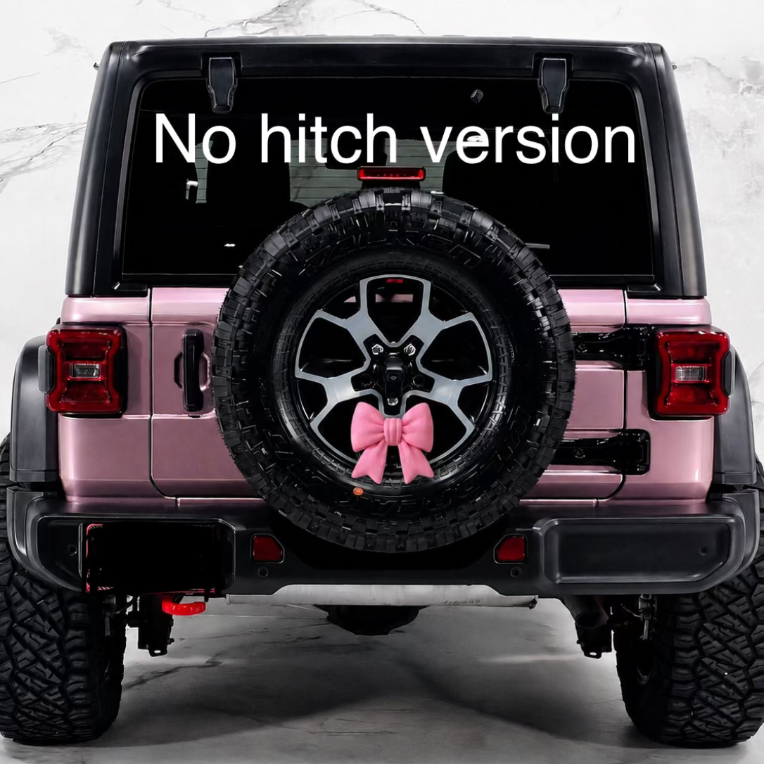 Rear view of a pink Jeep-style vehicle with a spare tire mounted on the back and a pink chunky bow attached to the tire. Large white text across the back window reads 'No hitch version.